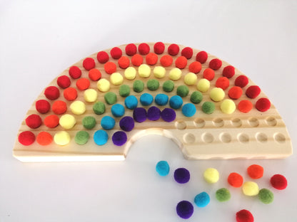 Wooden Rainbow Board with Pom Poms