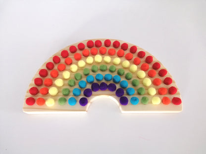 Wooden Rainbow Board with Pom Poms